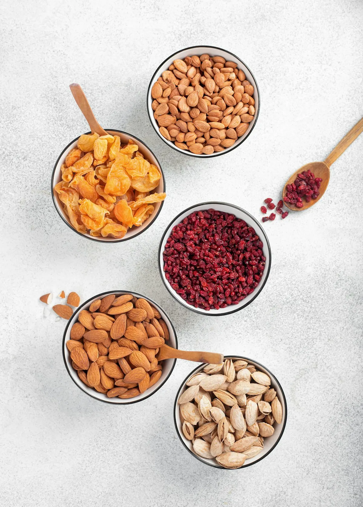 Bowls of nuts and dried fruit
